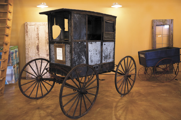 (Gabe Green | The Daily World) A 1871 mail buggy on display in the museum.