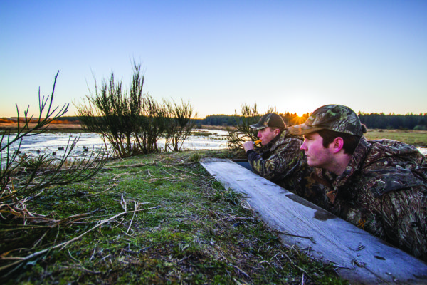 (Kyle Mittan | The Daily World) Aberdeen Mayor Erik Larson and brother Grant from a duck-hunting blind near Grayland.