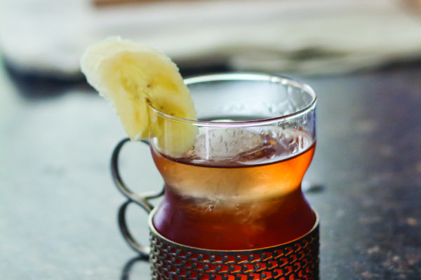 (Kyle Mittan) One of Ramos' original unnamed drinks uses Old Grand-Dad Bourbon, vermouth, amaretto liquer, bitter liquer and banana syrup. The drink is garnished with a slice of banana.