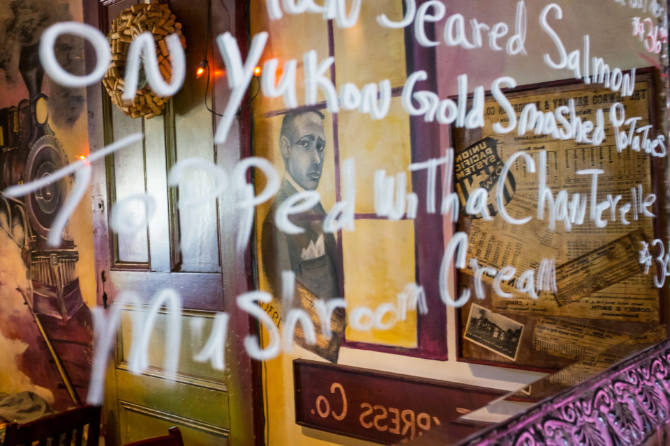 The specials of the day are written on a large mirror, which also reflects memorabilia from the building’s original use as – you guessed it – a train depot.